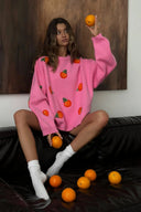 Flickors orangea flockade stickade tröja