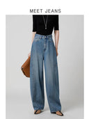 Jeans a vita alta di design con taglio arcuato