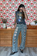 Jeans con ojales y estampado de leopardo