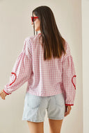 Blusa a maniche lunghe con cuori