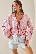 Blusa a maniche lunghe con cuori