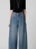 Jeans a vita alta di design con taglio arcuato
