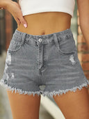 Short en denim stretch déchiré à ourlet effiloché