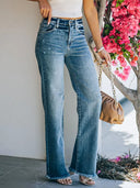 Jeans slim sbiaditi a vita media con orlo sfrangiato