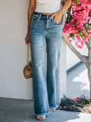 Jeans slim sbiaditi a vita media con orlo sfrangiato