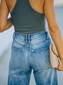 Pantaloni di jeans a vita alta strappati a gamba larga