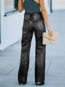 Pantaloni di jeans a vita alta strappati a gamba larga