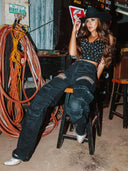 Jeans cargo con strappi e strass