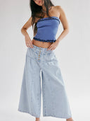 Jeans con bottoni e pieghe frontali