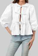 Blusa con maniche a sbuffo, peplo e fiocco