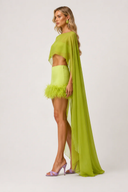 Limegrönt set med transparent cape och fjäderkjol