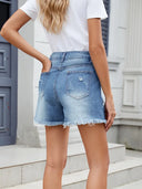 Zomerse denim shorts met franjes en distressed look