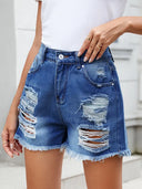 Zomerse denim shorts met franjes en distressed look
