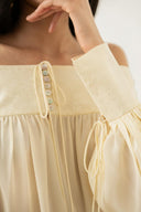 Robe crème à épaules dénudées