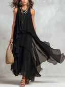 Abito lungo nero in chiffon a strati, senza maniche, con scollo rotondo