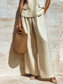 Completo due pezzi beige con gilet senza maniche scollo a V ampio e pantaloni a gamba larga