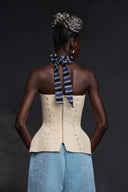 Top bustiê halter com motivo de rosto abstrato